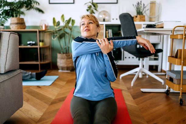 istock Senior woman practicing yoga at home 2191388643