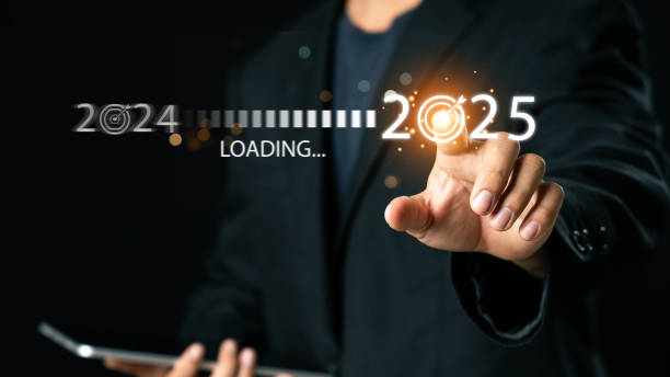 istock Progress and transition from 2024 to 2025 concept. A person pointing to loading bar transitioning from 2024 to 2025, progress, future planning, and new year goals. annual planning and business growth. 2191389498