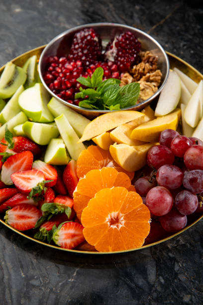 istock Fruit Salad Plate on the Black Marble Table 2191391351