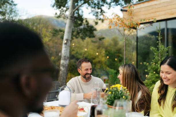 istock An outdoors dinner party with friends 2191391434