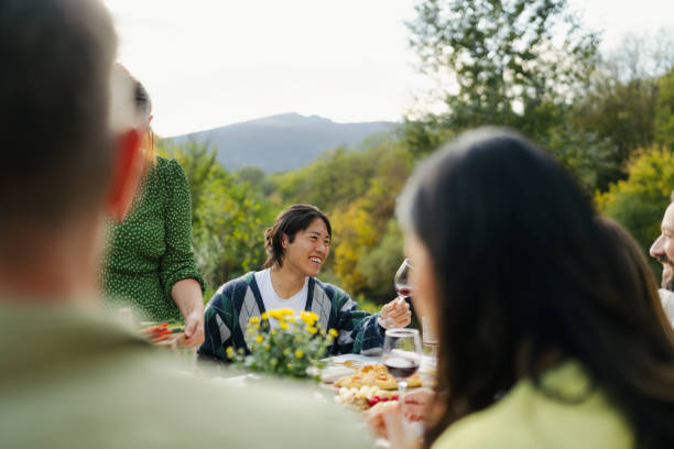 istock An outdoors dinner party with friends 2191391473