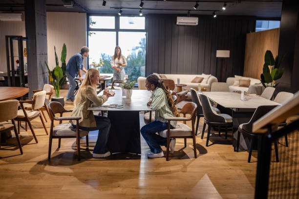 istock Customers discussing options at a modern furniture store 2191393472