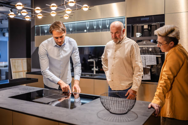 istock Inspecting sophisticated kitchen appliances in showroom 2191394402