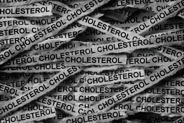 istock Strips of newspaper with the words Cholesterol typed on them. 2191394999