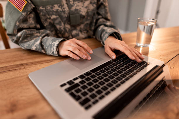 istock Female US Army Soldier Using Laptop at Home 2191395456