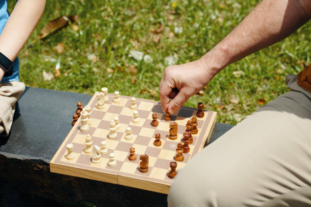 istock Grandfather Playing Chess With Grandson 2191395900