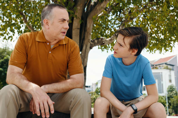istock Grandchild Having Conversation With His Grandfather 2191396188
