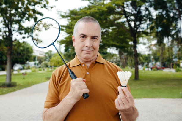 istock Grandfather Playing Badminton In The Park 2191396509
