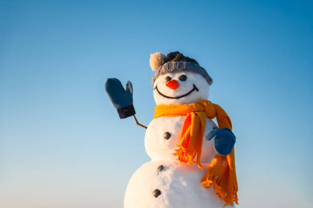 istock Smiley snowman in knitted hat 2191397058