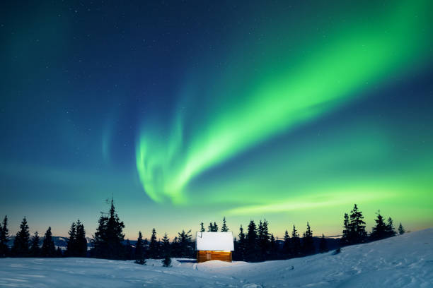 istock Incredible Northern lights over tiny wooden house 2191397190
