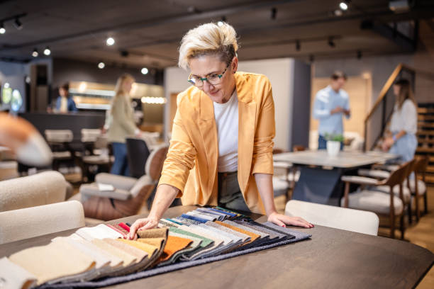 istock Woman examining fabric samples with detailed focus. 2191397312