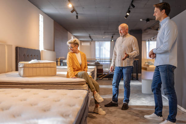 istock Exploring mattress options together in a showroom. 2191397457
