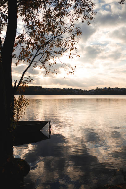 istock Calm Lake with a Small Boat 2191398773