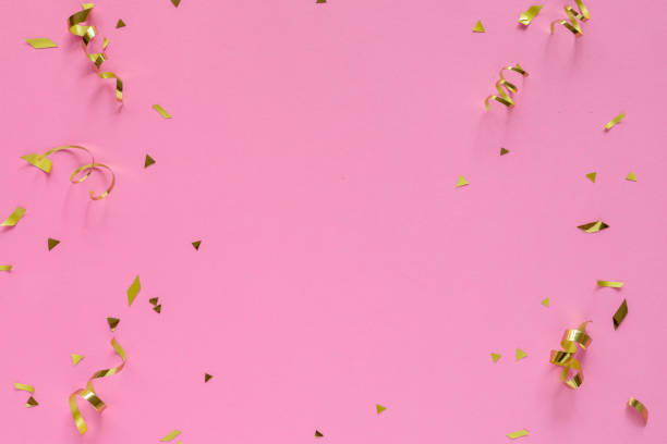 istock close up top view on rolling and confetti gold color on pink pastel background with copyspace for design as valentine card or mother day or wedding invitation concept 2191399797