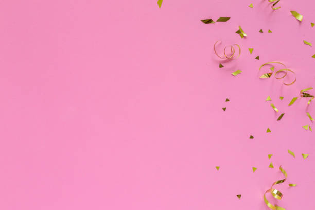 istock close up top view on rolling and confetti gold color on pink pastel background with copyspace for design as valentine card or mother day or wedding invitation concept 2191399798