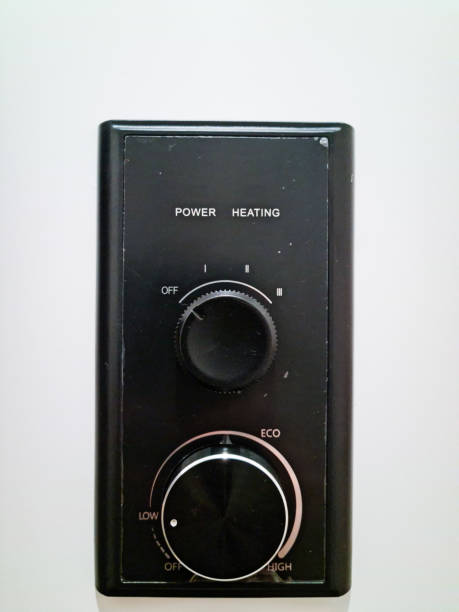 istock A black thermostat is mounted on a white wall. 2191399831