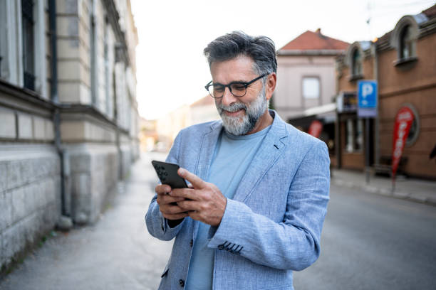istock Man using phone in the city 2191400642
