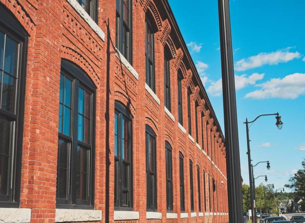 istock Windows and ornate cornice on restored textile mill building 2191400788