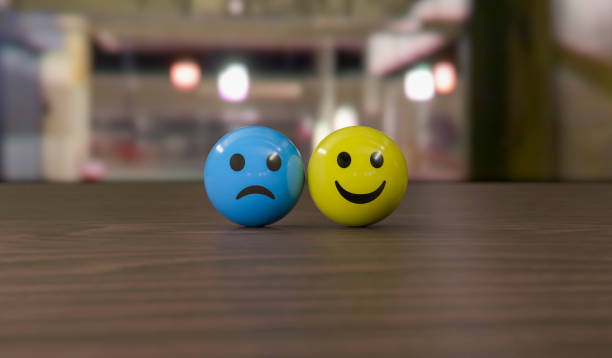 This visual represents the topic of “Mental Health and Emotional State” in a simple but effective way. Two different facial expressions, a blue sad face and a yellow happy face, standing close to each other, symbolize the fluctuation of human emotions and the ups and downs associated with mental health.\n\nSmile icon : https://creazilla.com/media/emoji/46128/smiling-face\nSad icon : https://creazilla.com/media/emoji/58207/sad-but-relieved-face