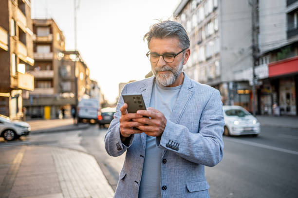 istock Man using phone in the city 2191400850