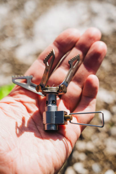 istock A person is delicately holding a compact stove securely in their hand 2191401024
