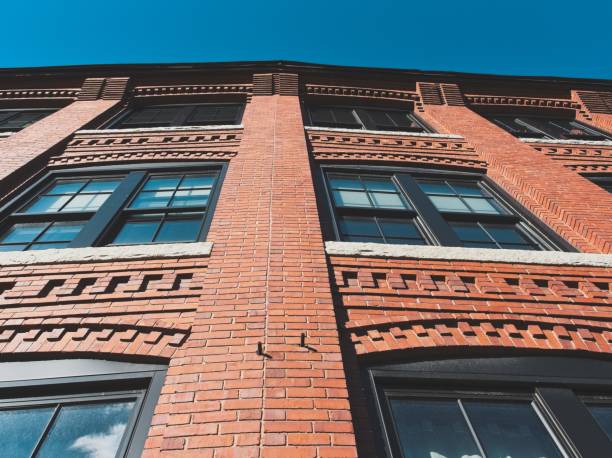 istock Windows and ornate cornice on restored textile mill building 2191401172