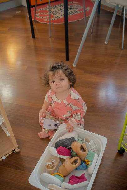 istock Baby exploring the box of shoes 2191405897