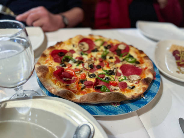 istock Tasty pepperoni pizza with basil on grey table 2191406960