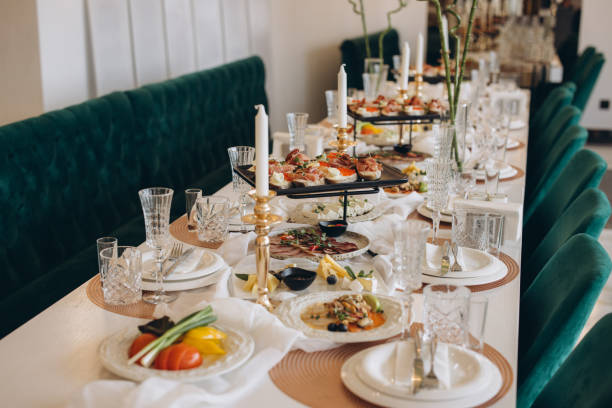 istock Elegant wedding table setting with delicious appetizers and golden candlesticks 2191407566