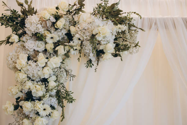istock Floral arrangement decorating wedding arch with white curtain 2191407575