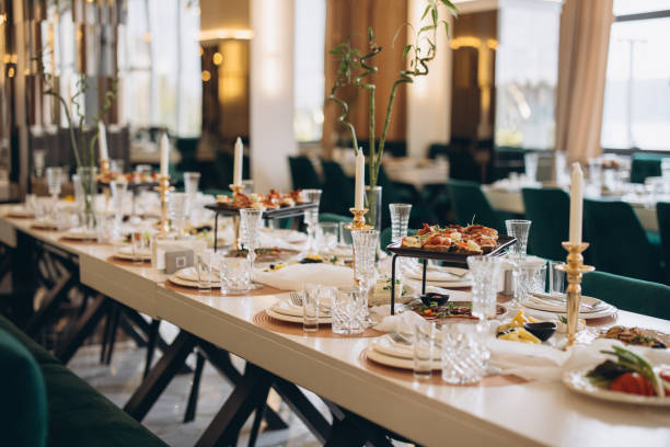 istock Elegant wedding table setting with appetizers, candles and crystal glasses 2191407584