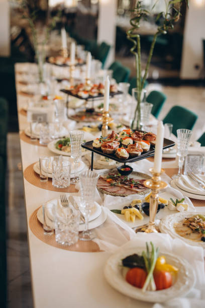 Elegant wedding table setting with appetizers, charcuterie and candles