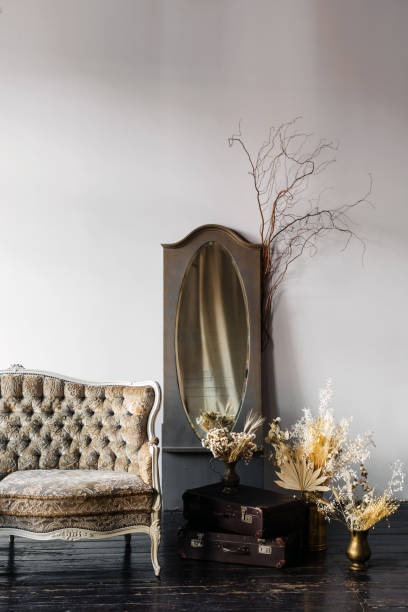 istock Comfortable vintage sofa in a stylish living room with decorative elements 2191407735