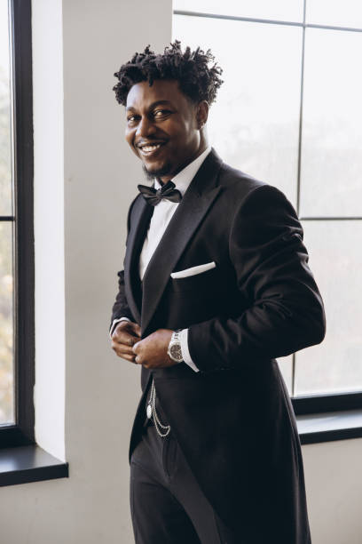 istock Elegant groom adjusting his jacket before wedding ceremony 2191408011