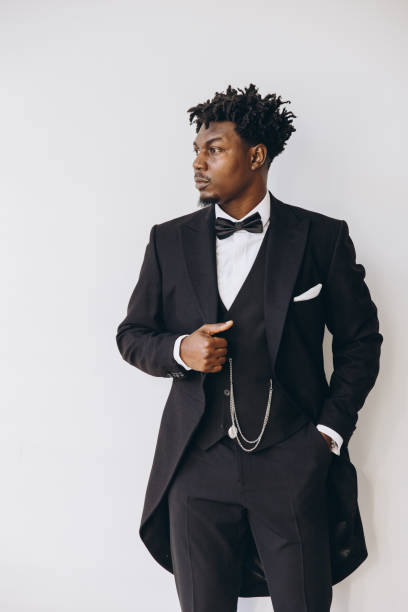 istock Elegant groom wearing black suit posing before wedding ceremony 2191408095