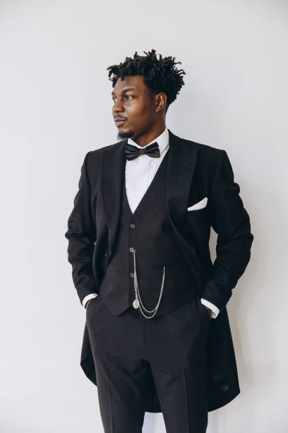 istock Elegant groom wearing black suit posing before wedding 2191408109