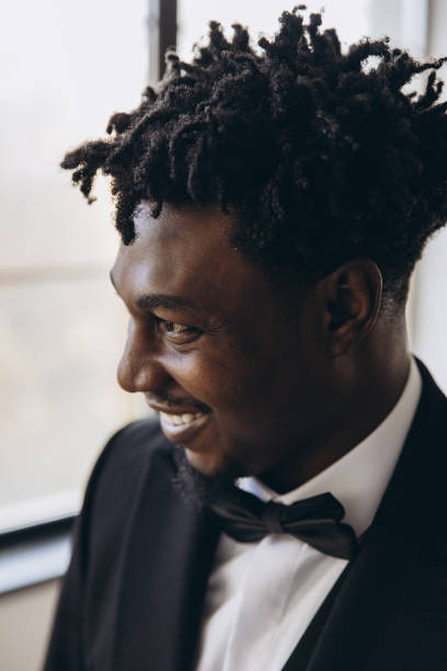 istock Elegant businessman smiling wearing suit and bow tie 2191408460