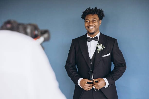 istock Videographer Recording Groom Getting Ready Before Wedding Ceremony 2191408576