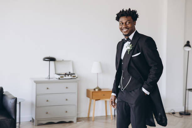 istock Groom wearing elegant suit posing in bright room before wedding 2191408628