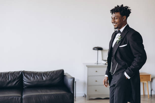 istock Groom smiling and walking in elegant suit before wedding ceremony 2191408646