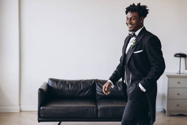 istock Elegant groom walking in hotel room before wedding ceremony 2191408667