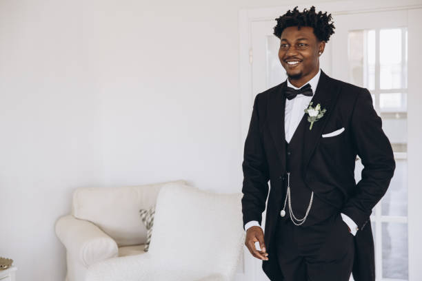 istock Elegant Groom Smiling and Getting Ready for Wedding Ceremony 2191408690