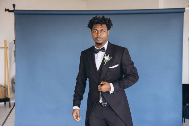 istock Groom wearing elegant suit posing in photo studio 2191408712