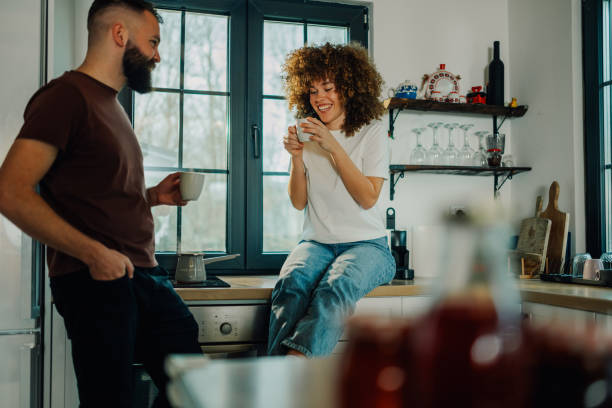 istock Couple enjoying morning coffee in modern kitchen 2191409408