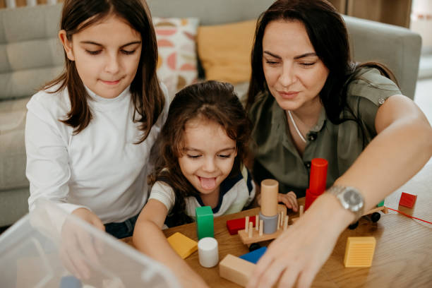 istock Mom play with kids 2191409525