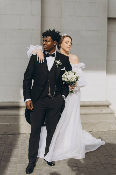 istock Interracial Couple Posing Together on Wedding Day 2191409872