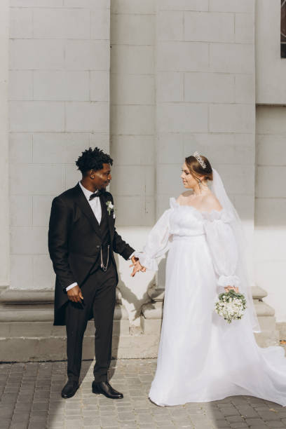 istock Interracial Couple Holding Hands After Wedding Ceremony 2191409878