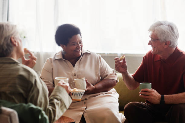 Senior People Enjoying Tea Time Chatting at Home