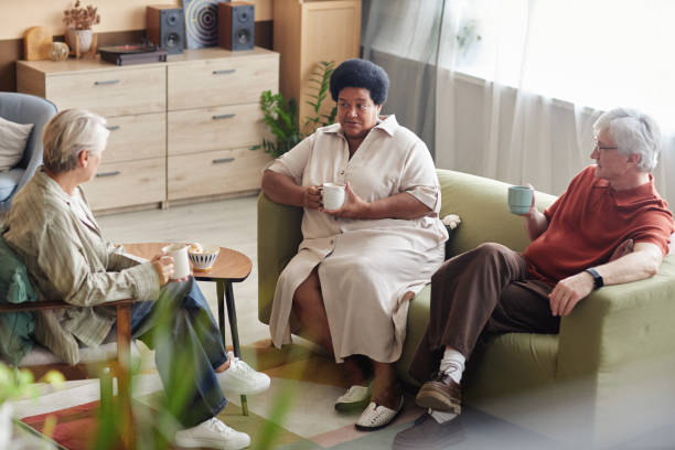 istock Three Senior People Enjoying Conversation at Home 2191411124