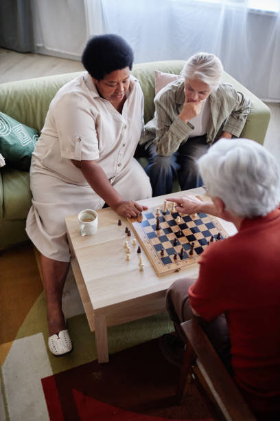 istock Senior People Playing Chess with Friends 2191411136